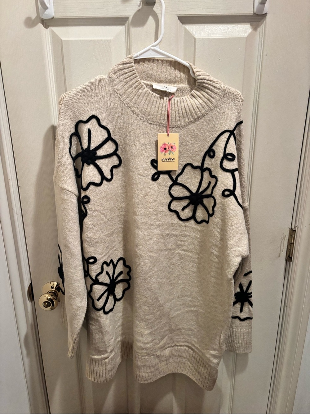 entro Cream Crewneck Sweater with Black Floral Appliqué